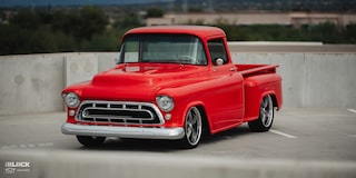 Close-up Front Three-Quarters View of David Kinnison's 1957 Chevrolet 3100 Truck in a Parking Lot