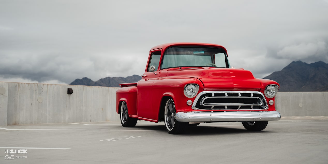 Front Three-Quarters View of David Kinnison's 1957 Chevrolet 3100 Truck in a Parking Lot
