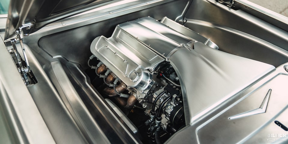 A Close-up of a Silver Shiny Polished Engine of a 1959 Impala