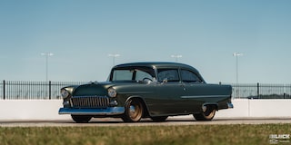 Three Quarters View of a 1955 Chevrolet under a Clear Blue Sky