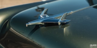 Close-up of the 1955 Chevrolet Emblem Glowing under the Sun