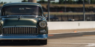 Front View of a Green 1955 Chevrolet at Eye Level at the Edge of the Frame