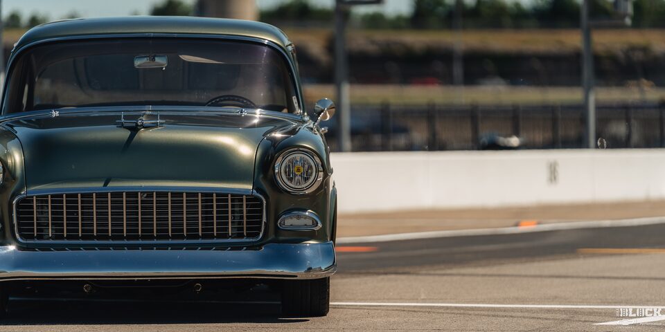 Front View of a Green 1955 Chevrolet at Eye Level at the Edge of the Frame