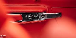 Close-up View of a 1969 Chevy Corvette Door Lock/Unlock Switch with an Orange Colored Interior