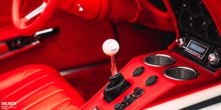 Close-up of the Interior of Don Milligan’s 1969 Corvette Stingray with “Hurst” Written in Black Letters on the White Gearshift