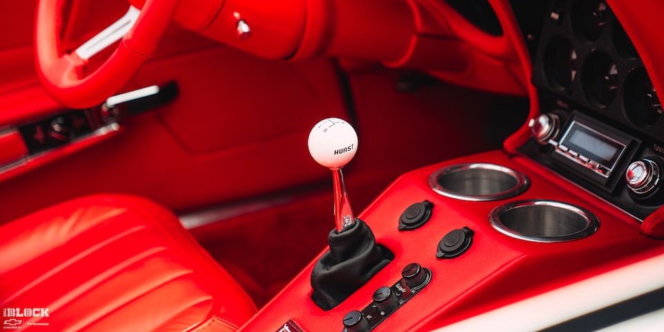 Close-up of the Interior of Don Milligan’s 1969 Corvette Stingray with “Hurst” Written in Black Letters on the White Gearshift