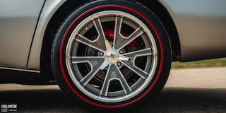 Close-up of a Tire with a Red Finish and a "Forgeline" Logo on Don Milligan’s Silver 1969 Corvette C3 Stingray