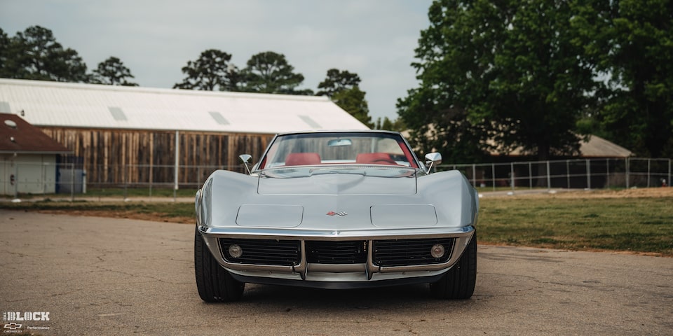 Front View of Don Milligan's Silver 1969 Corvette C3 Stingray Parked in Front of a Rural Garage