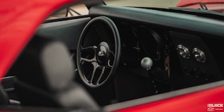 A View of the Steering Wheel of a 1968 Chevy Camaro from the Right Window