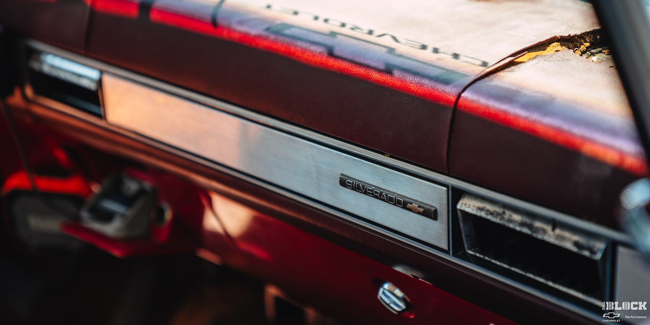 Close-up of the Interior of a Red Chevy Performance Silverado Viewed through the Right Window