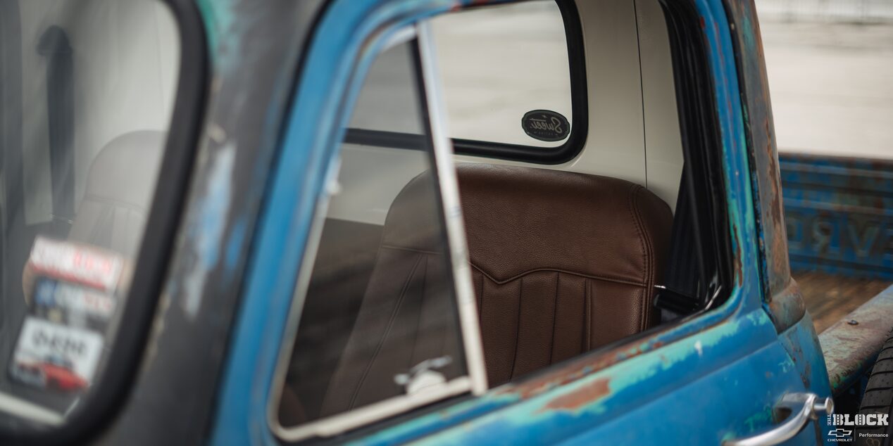 A Shot of the Driver’s Seat through the Window of a 1955 Chevy Pickup Truck