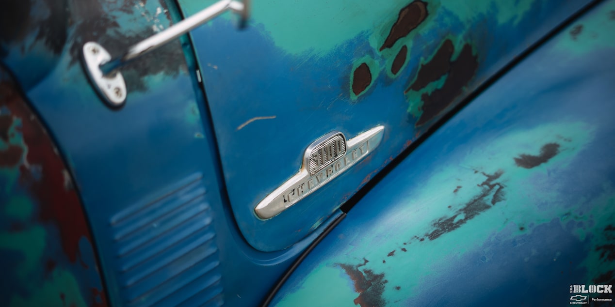 A Shot of the Chevrolet Emblem on the Side of a 1955 Chevy Pickup Truck