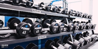Several Shelves of Dumbbell Weights in the Workout Room at the GM Charlotte Technical Center.
