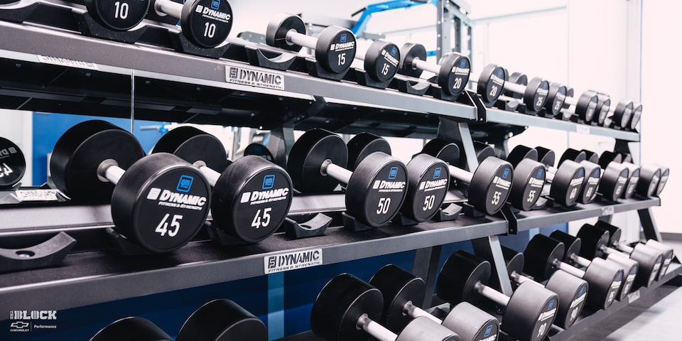 Several Shelves of Dumbbell Weights in the Workout Room at the GM Charlotte Technical Center.