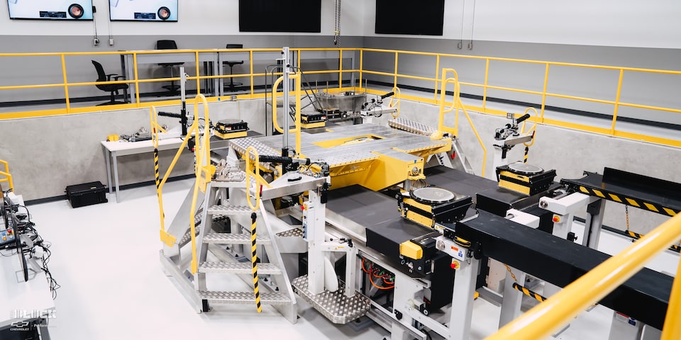 A GM Employee Stands Near the Suspension Parameter Measurement Machine at the GM Charlotte Technical Center.