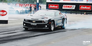 Front Three-Quarters Close Up View of a Chevrolet Copo Camaro Performing a Burnout
