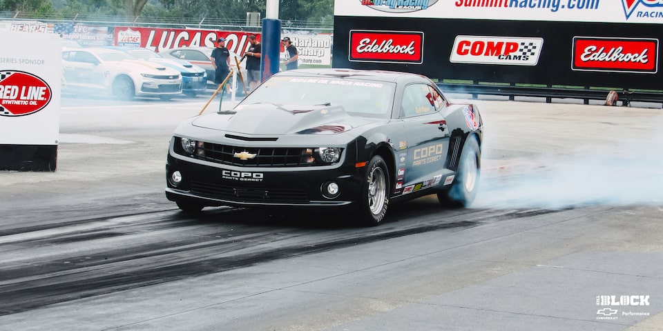 Front Three-Quarters Close Up View of a Chevrolet Copo Camaro Performing a Burnout
