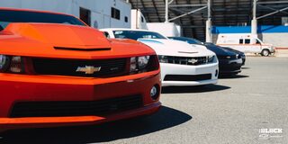 Close Up View of the Grilles on Chevrolet Copo Camaros in a Lineup