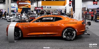 Side View of a Chevrolet Copo Camaro in a Showroom