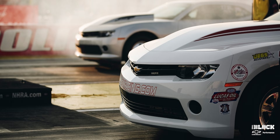 Close Up of a Chevrolet Copo Camaro's Grille While On The Race Track