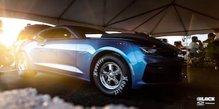 Close Up Front Three-Quarters View of a Chevrolet Copo Camaro with a Sunset in the Background