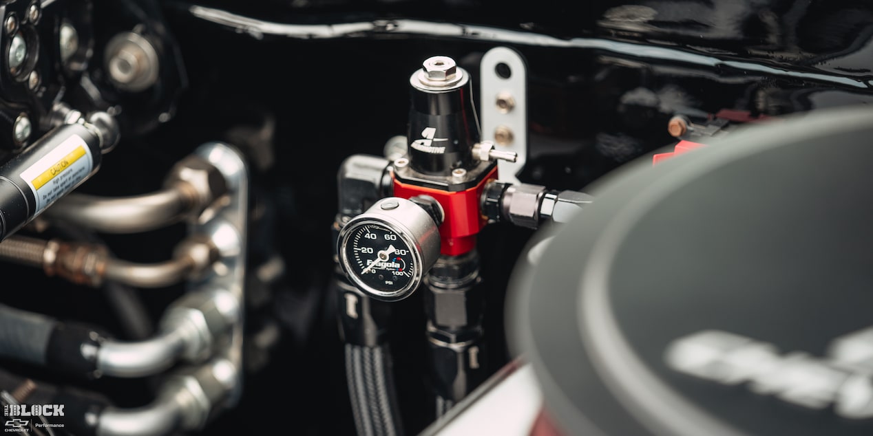 An Engine Component With a Pressure Gauge in Becky and Derek Luck's Vintage 1969 Chevrolet Camaro SS