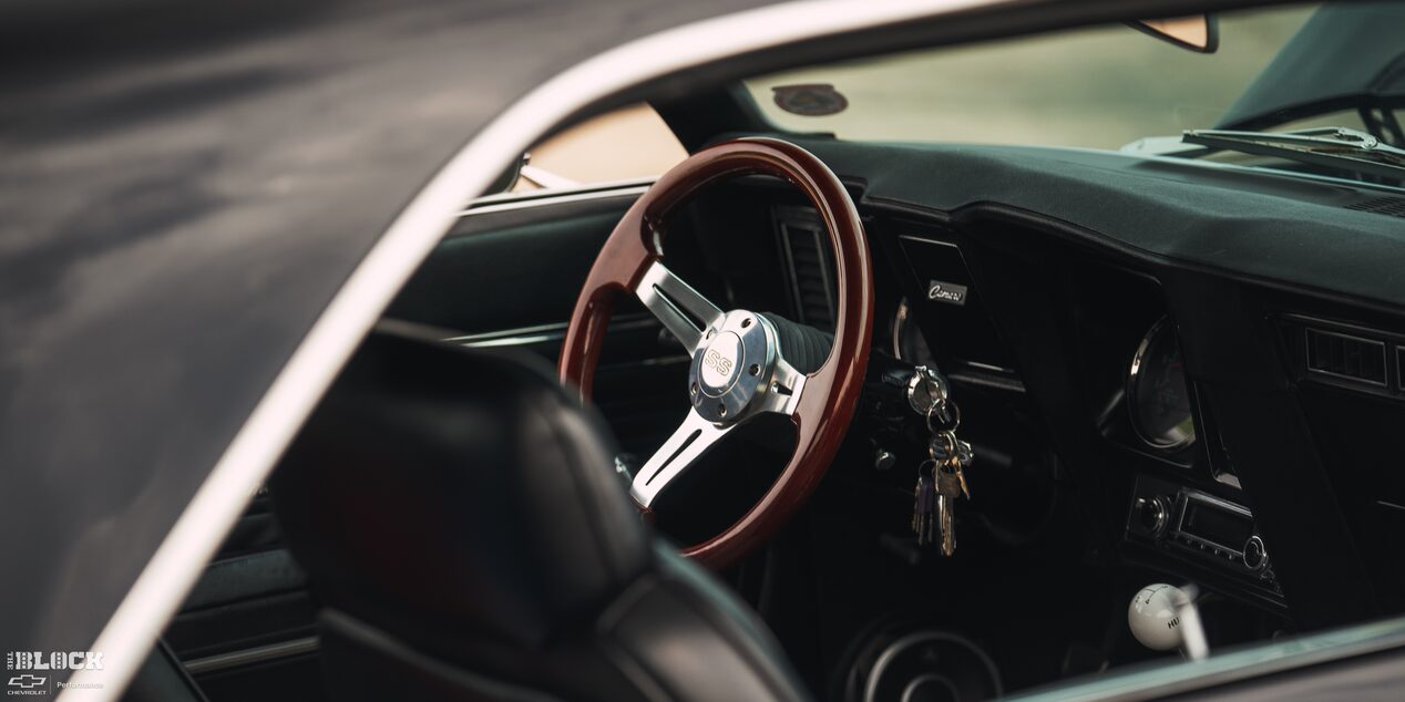View of the Steering Wheel Through the Passenger Window of Becky and Derek Luck's Vintage 1969 Chevrolet Camaro SS