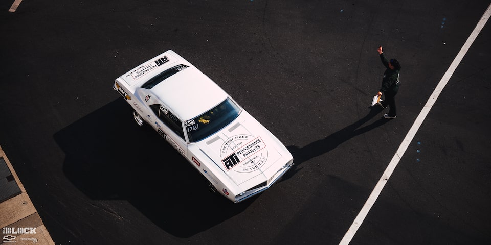 Overhead View of a White Chevrolet Muscle Car With the "ATI Performance Products" Logo on the Hood at the 2024 NHRA 4-Wide Nationals