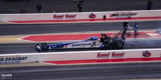 Side View of a Top Fuel Dragster Speeding Down the Track at the 2024 NHRA 4-Wide Nationals
