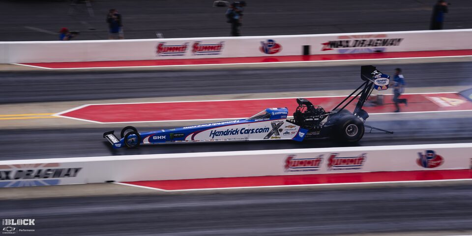 Side View of a Top Fuel Dragster Speeding Down the Track at the 2024 NHRA 4-Wide Nationals