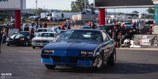 Front View of a Blue GM Sportscar Parked off the Track at the 2024 NHRA 4-Wide Nationals