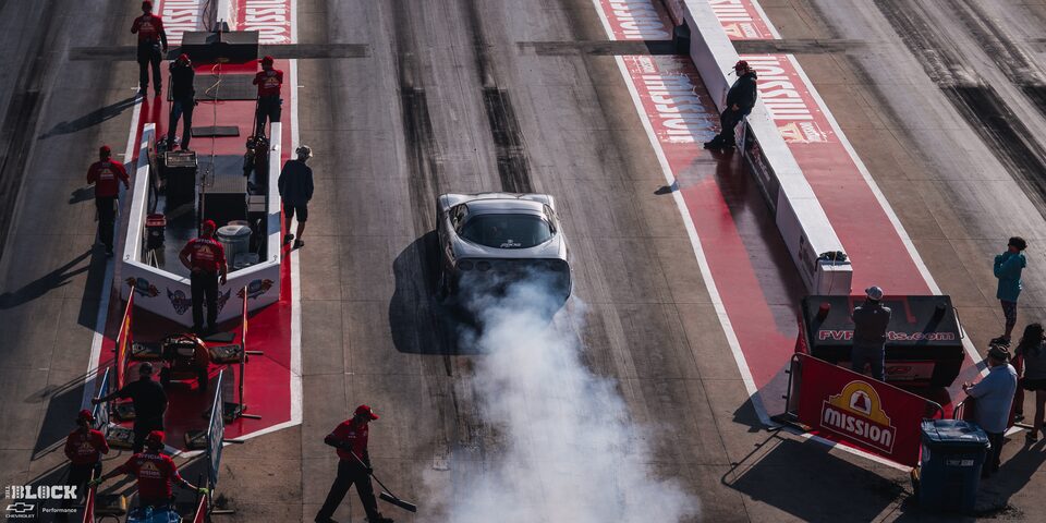 Overhead Rear View of a GM Sports Car Burning Rubber at the 2024 NHRA 4-Wide Nationals