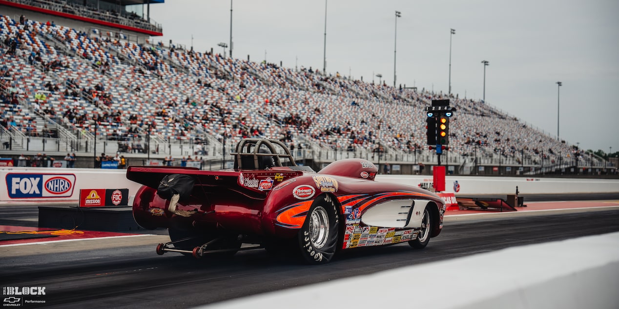 Rear Three Quarters View of a Red Race Car at Charlotte Motor Speedway