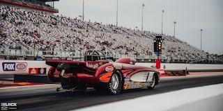 Rear Three Quarters View of a Red Race Car at Charlotte Motor Speedway
