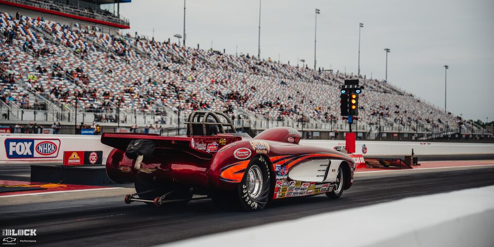 Rear Three Quarters View of a Red Race Car at Charlotte Motor Speedway