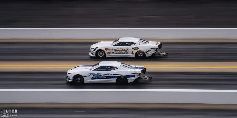 Two White Funny Cars Race Neck and Neck at the 2024 NHRA 4-Wide Nationals