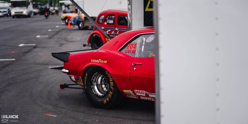 Side Rear View of a Park Red Chevrolet Race Car at Charlotte Motor Speedway