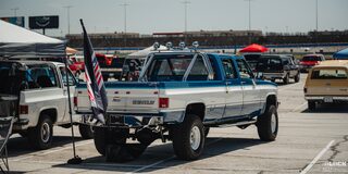 Rear View of a Parked Blue and White Classic Chevy Pickup Truck Parked at the 2024 Texas C10 Nationals