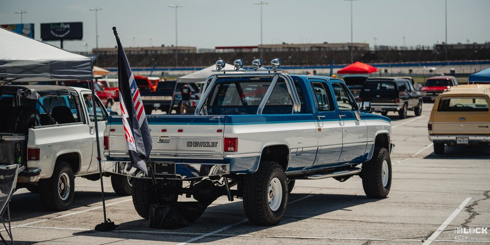Rear View of a Parked Blue and White Classic Chevy Pickup Truck Parked at the 2024 Texas C10 Nationals