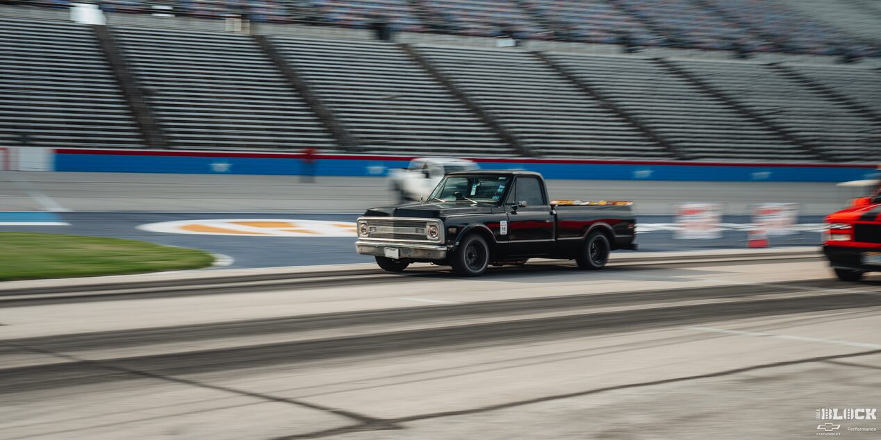 A Classic Chevy Pickup Truck Speeds Down the Track at Texas Motor Speedway