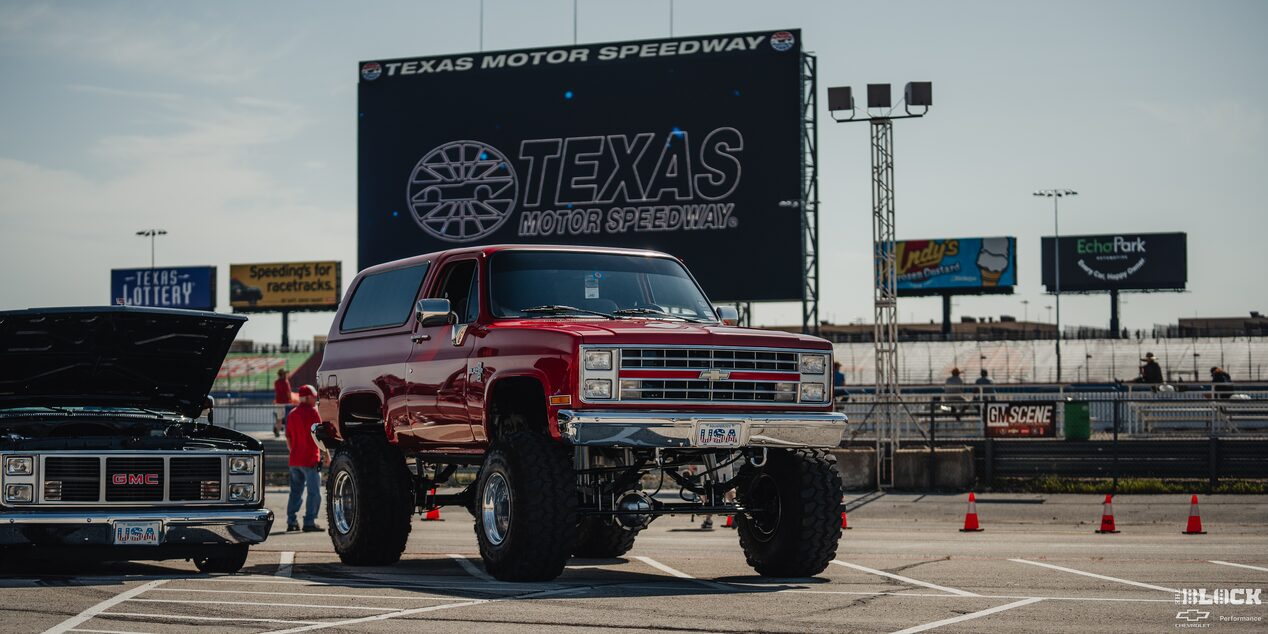 A Gigantic Red Chevy Pickup Truck Parked at Texas Motor Speedway