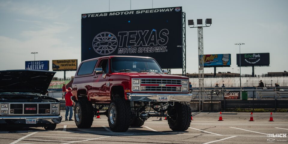 A Gigantic Red Chevy Pickup Truck Parked at Texas Motor Speedway