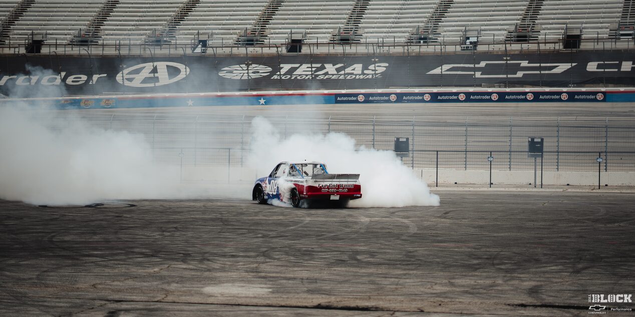 Rear View of a Chevy Pickup Truck Burning Rubber at Texas Motor Speedway