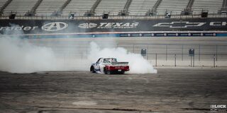 Rear View of a Chevy Pickup Truck Burning Rubber at Texas Motor Speedway