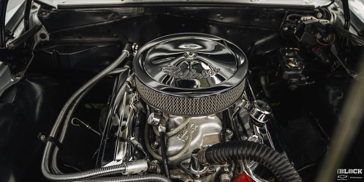 Overhead View of a Silver Air Filter Sitting on Top of an Engine Shining in the Vehicle