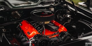 Three Quarters View of a Chevy Engine with an Orange Body 