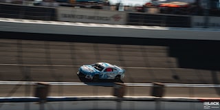 Overhead Shot of a Custom Chevy Racecar Speeding Down a Racetrack
