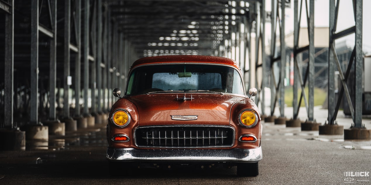 Front View of an Orange 1955 Chevy Handyman Wagon Wet from the Rain
