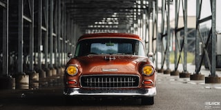 Front View of an Orange 1955 Chevy Handyman Wagon Wet from the Rain