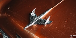 Close-up of the Steel Jet Plane Hood Emblem on a 1955 Chevy Handyman Wagon